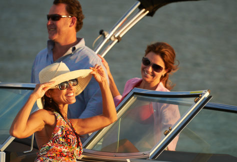Three Close-up People Basking in the Sun on a Cobalt at Sunset