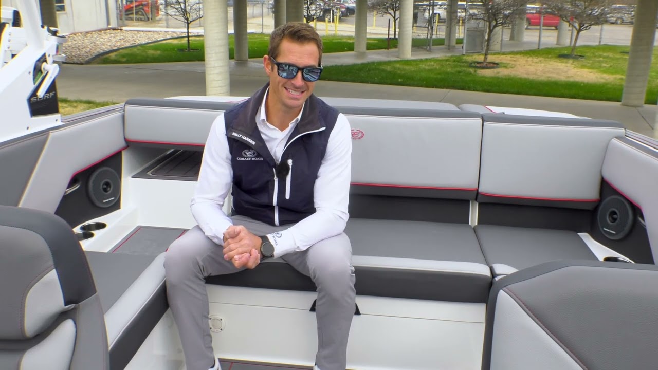person sitting in back of a boat and talking