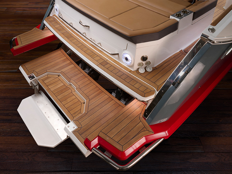 Cobalt Boats hydraulic swim step and platform fully extended with teak wood inlay and LED accent lighting
