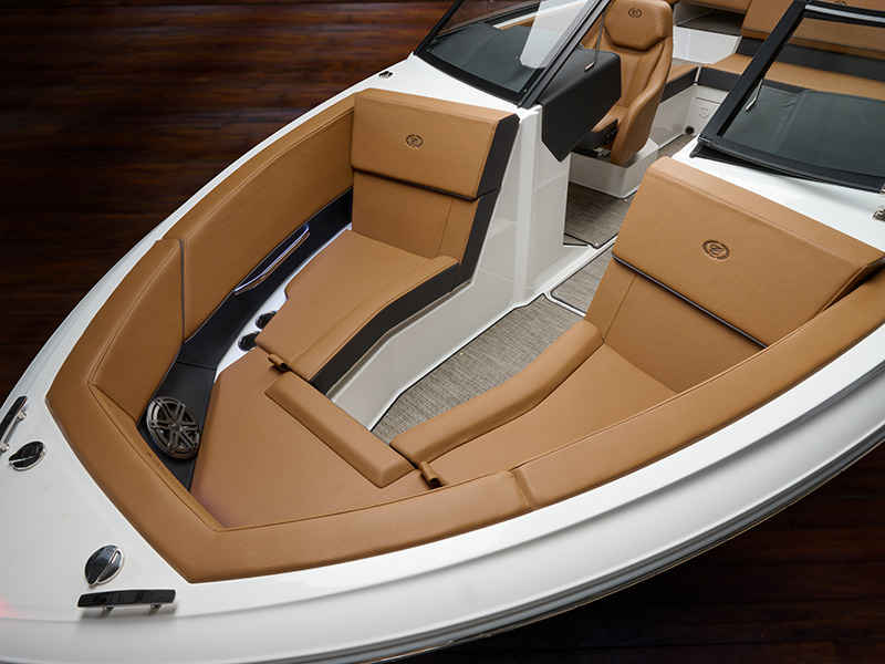 Cobalt CS22 spacious bow seating area with premium tan leather upholstery and convertible center cushion viewed from above in studio
