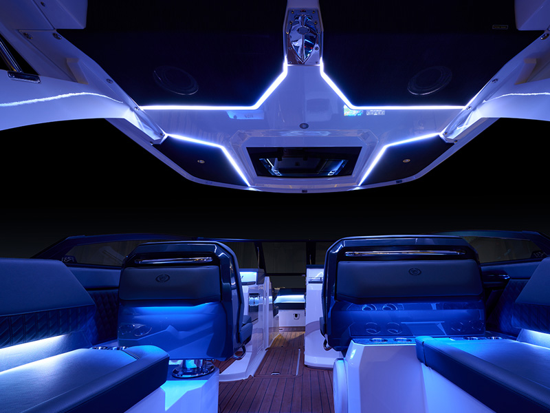 Cobalt R31 Coastal interior with programmable blue LED accent lighting illuminating the full cabin at night