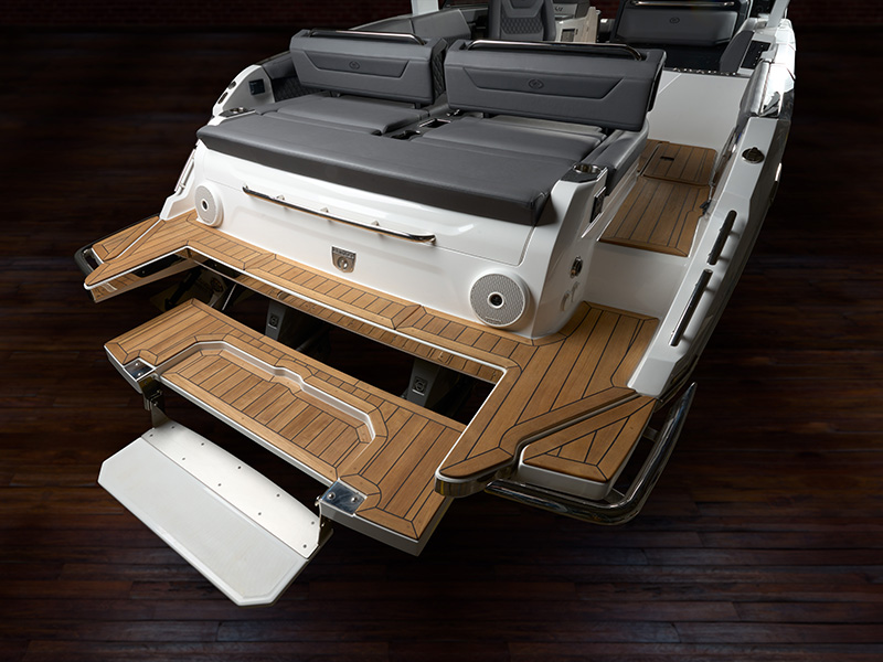 Cobalt R31 Sterndrive hydraulic swim platform and swim step fully extended with teak inlay and Cobalt shield badge