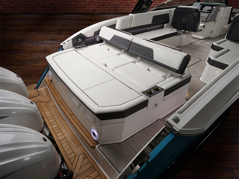 Cobalt R33 Coastal aft backrest and rear seating area with white upholstery and twin Yamaha outboard engines