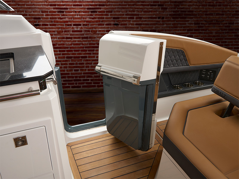 Cobalt R33 side entry door open showing molded white door panel and tan upholstered interior seating