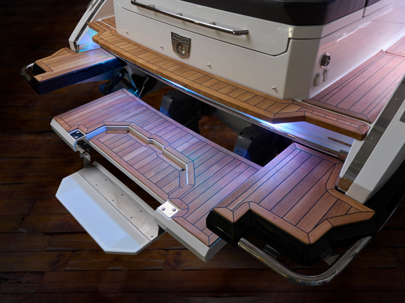 Cobalt R35 Sterndrive hydraulic swim platform with illuminated teak swim step fully extended