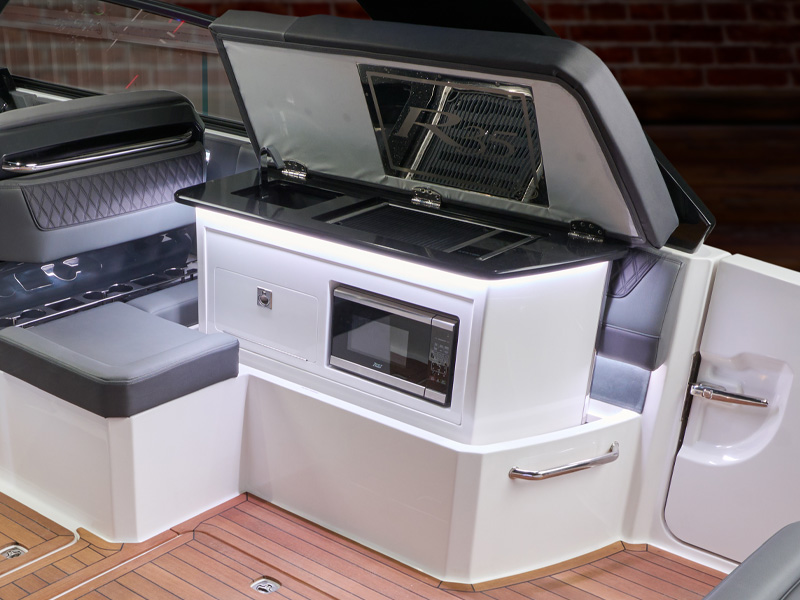 Cobalt R35 Surf spacious interior seating layout with integrated galley, grill, and microwave