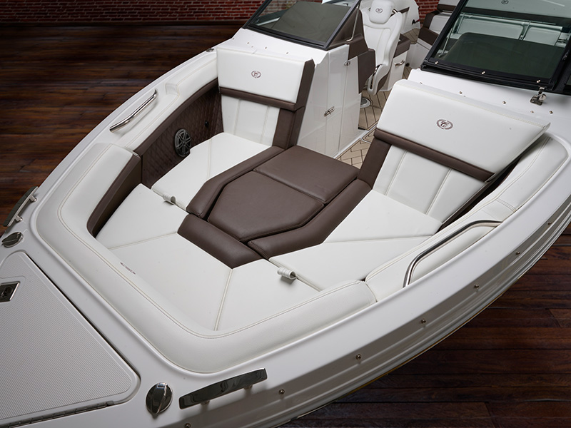 Cobalt R4 Coastal bow filler cushion with white and tan upholstery creating a spacious forward sunpad and lounge area