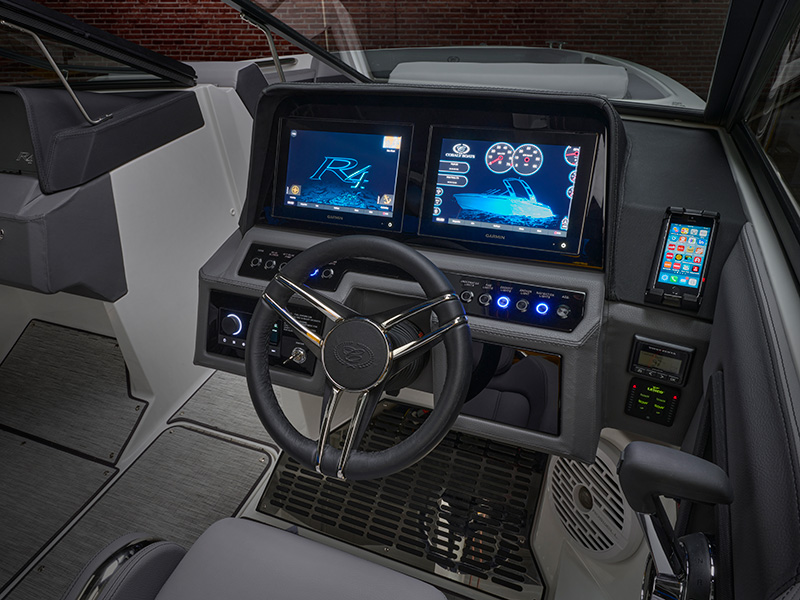 Cobalt R4 Sterndrive helm with dual Garmin touchscreen displays showing R4 boat system interface and navigation