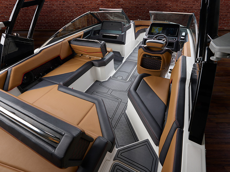 Cobalt R4 Surf full interior styling with premium tan leather and black upholstery, surf helm station, and open seating layout