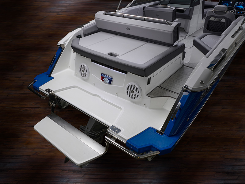 Cobalt R4 Sterndrive swim step fully extended viewed from above with blue hull accent and Cobalt badge