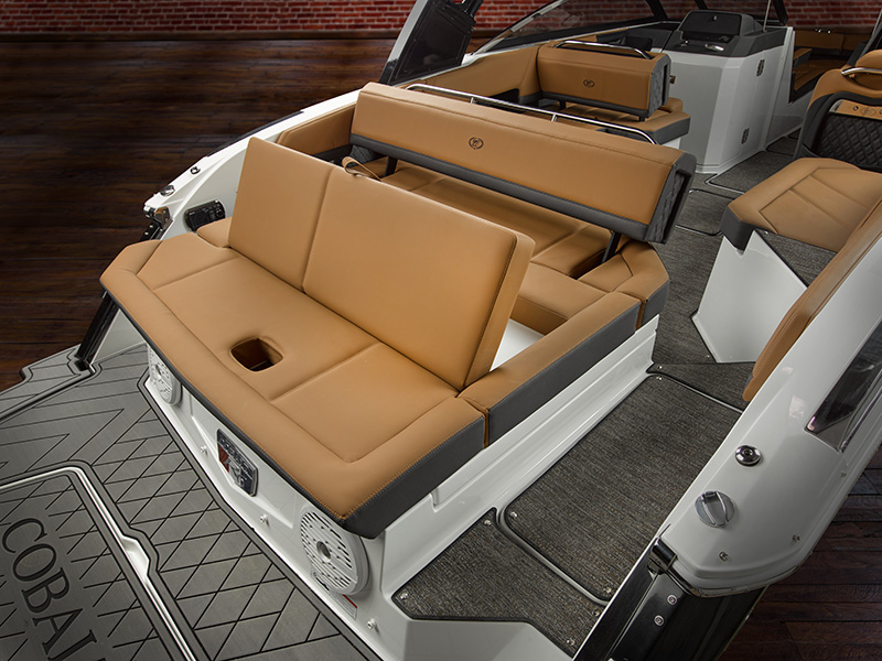 Cobalt R6 Sterndrive aft-facing rumble seat with tan leather upholstery and integrated cup holders