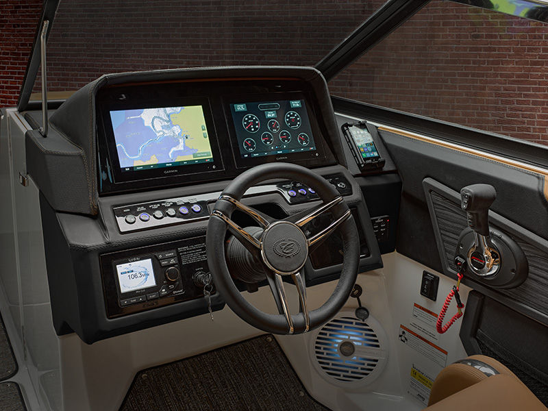 Cobalt R6 Sterndrive helm with dual Garmin touchscreen displays showing navigation chart and engine gauges