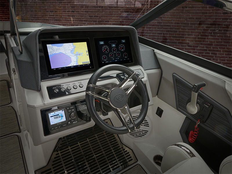 Cobalt R6 Outboard helm with dual Garmin touchscreen displays showing navigation chart and engine gauges