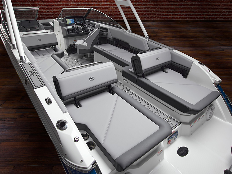 Cobalt R8 Coastal interior with aft backrest and spacious gray upholstered seating layout