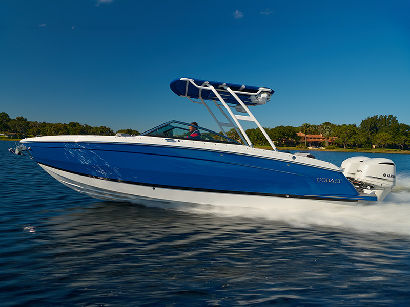 Cobalt R8 outboard with sport tower and blue sunshade running at speed on open water with Yamaha outboard