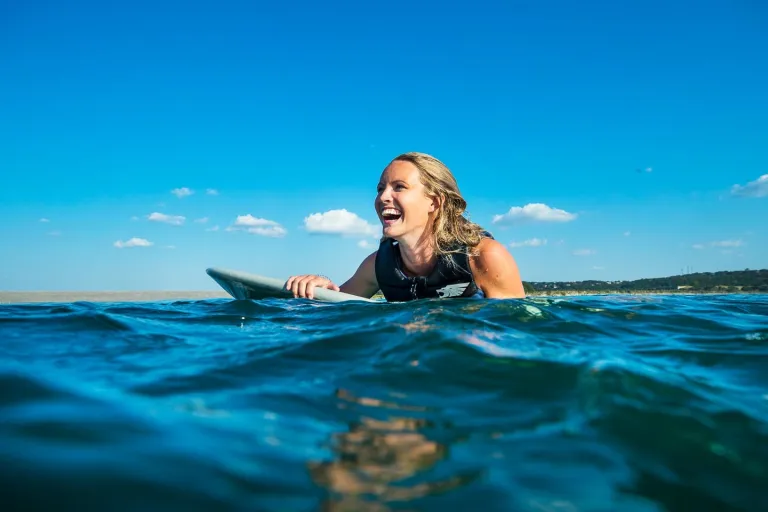 person in water about to surf