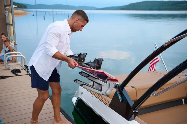 person on shore near boat