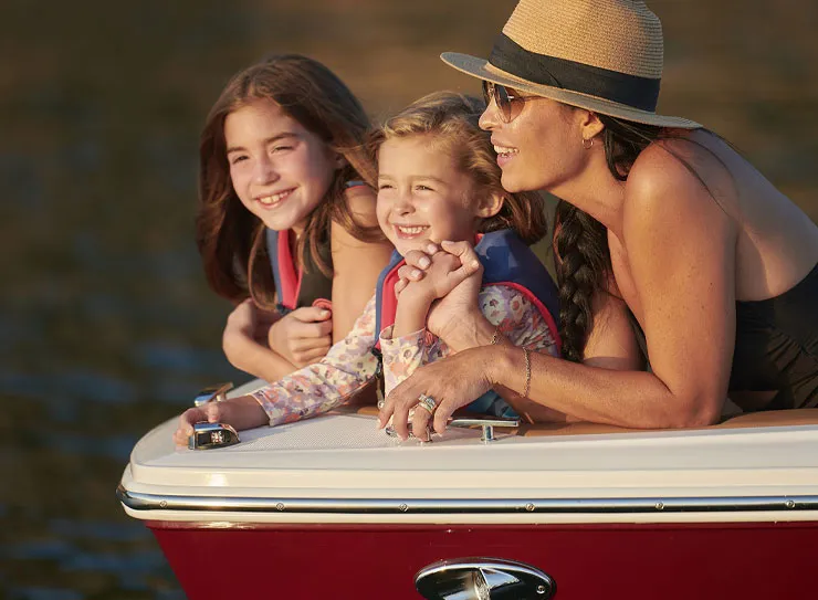 family at front of boat