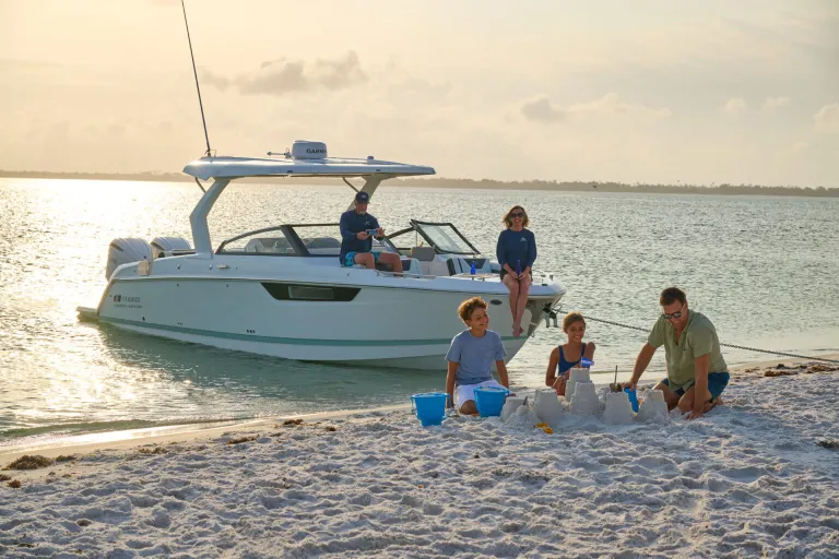 people on shore near a boat