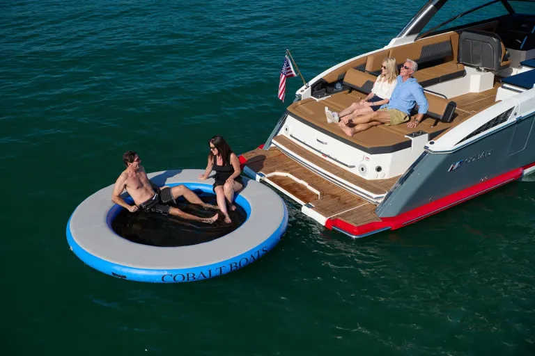 people by the boat in water