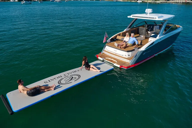 people by the boat in water