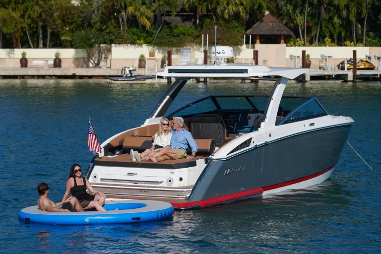 people by the boat in water