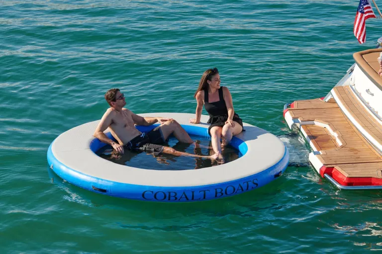 people by the boat in water