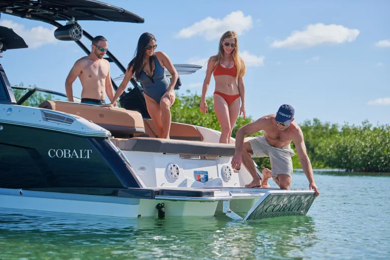 people on the back of a boat