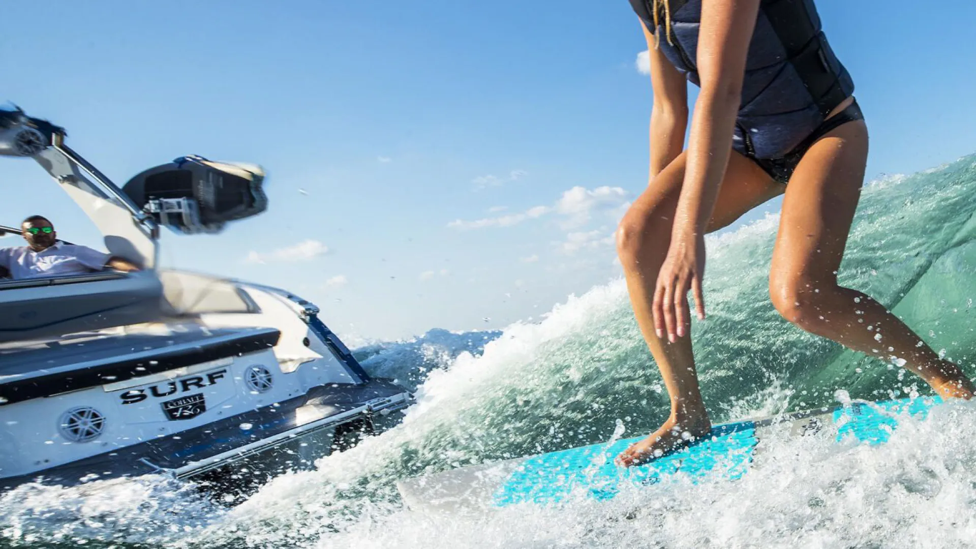a person surfing behind a boat