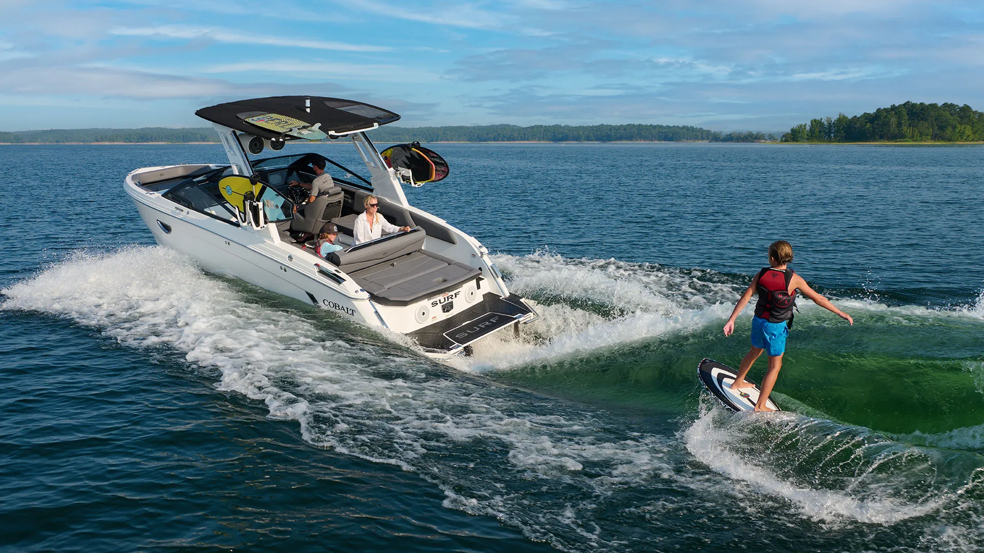 a person wakesurfing behind a boat
