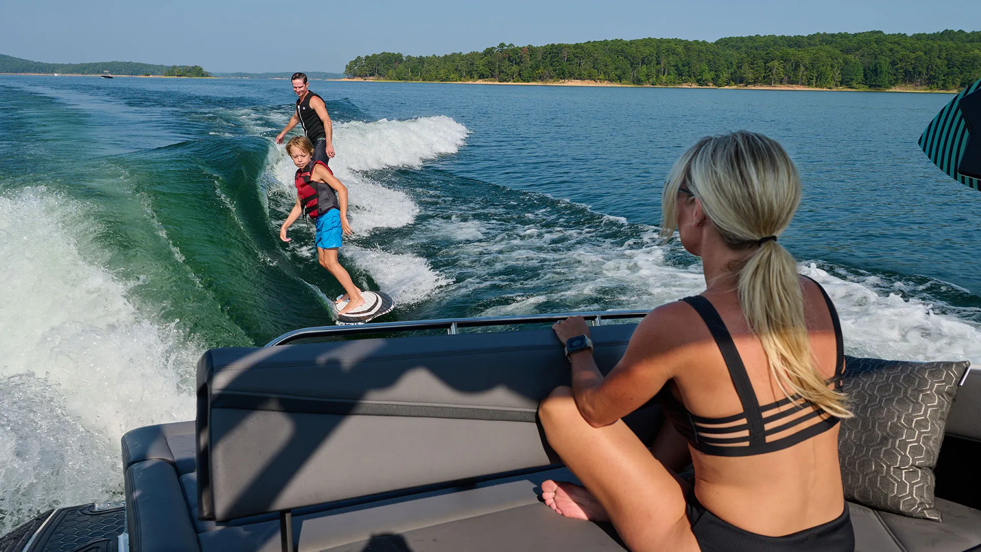 a person wakesurfing behind a boat