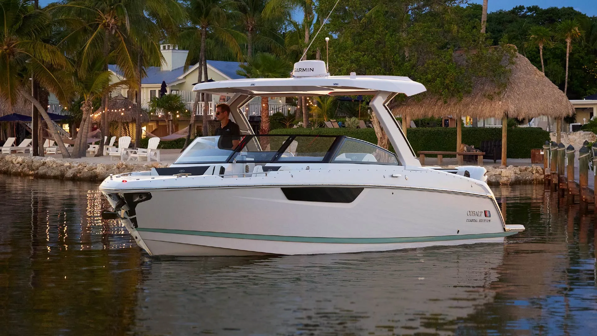 a man overlooking the lake on a cobalt coastal edition boat