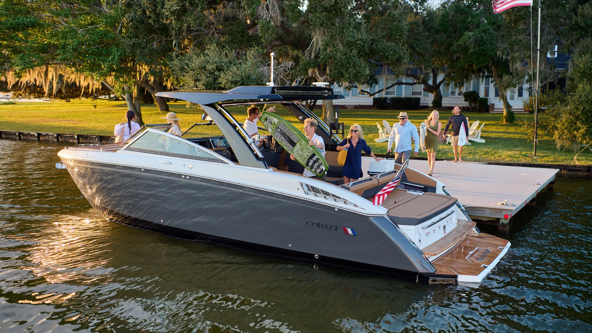 Friends getting on a Cobalt boat.