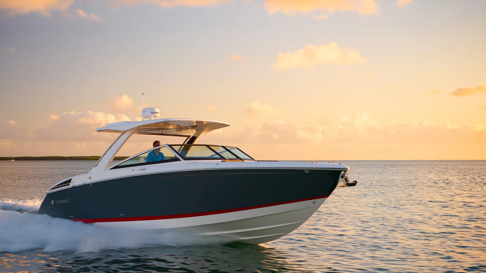 Cobalt Boats performance cruising footer banner image featuring boat running at speed across open water in ideal conditions