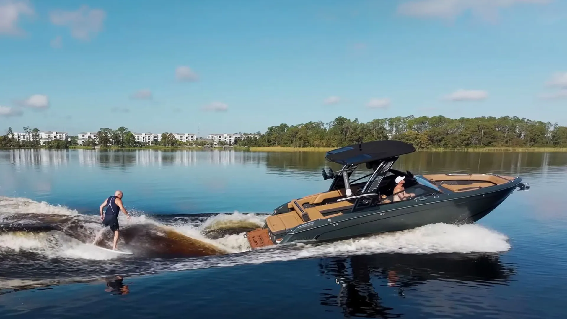 Cobalt R8 Surf boat with professional wakeboard athlete Shaun Murray hero banner showcasing the premium surf wake performance